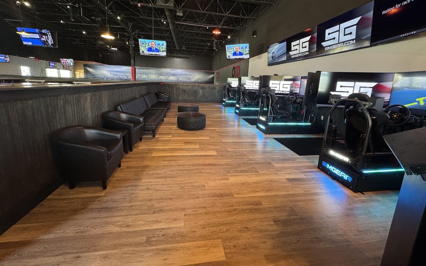 SimGear racing simulator seats with display wall at On The Dunes Sports in Commerce Township